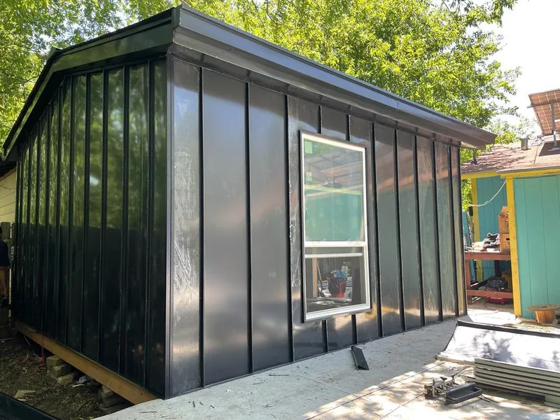 Black standing seam metal wall panels for Roof Inspection in Peters