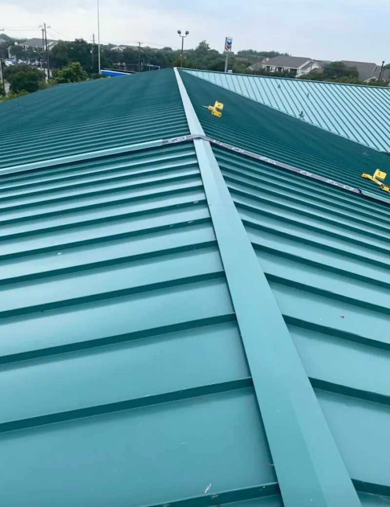 Green commercial metal roof ridge and valley for Metal Roof Repair in Peters